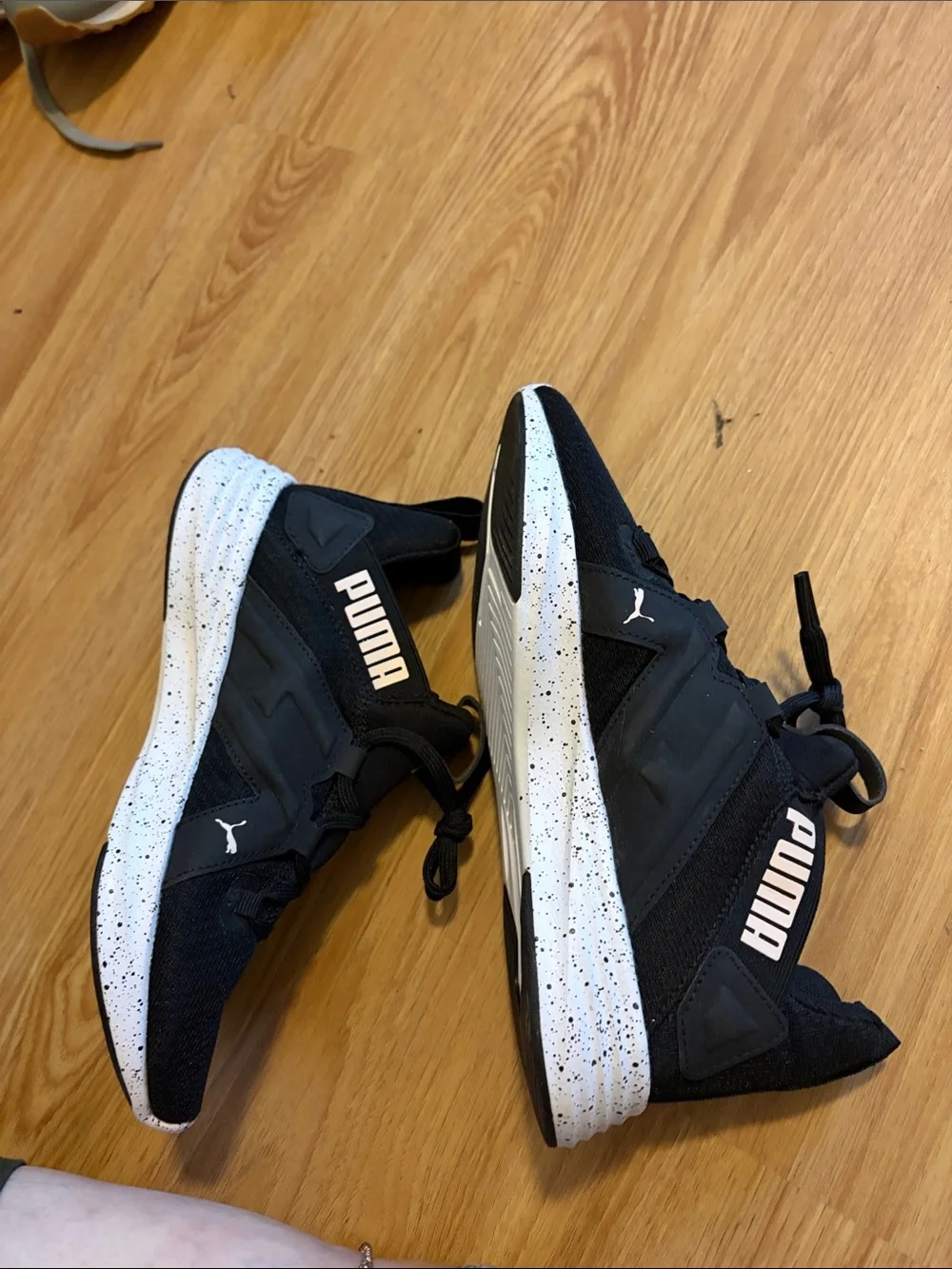 Puma women’s Black Athletic Sneakers with White Accent